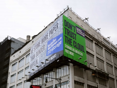 A billboard advertisement for Manhattan Mini-Storage. The green background and mention of “the cloud” is a direct reference to MakeSpace. Via Business Insider & MakeSpace