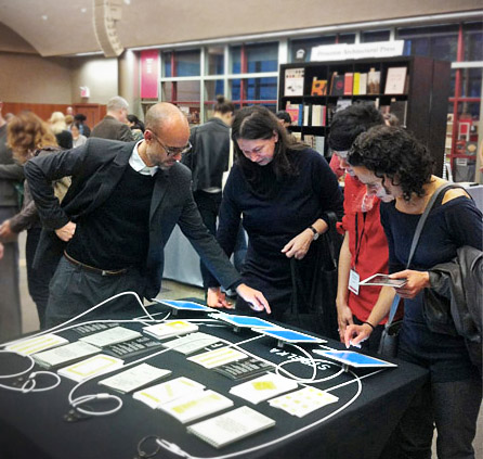 Justin McGuirk showing Strelka products to our graphic designer Irma Boom.