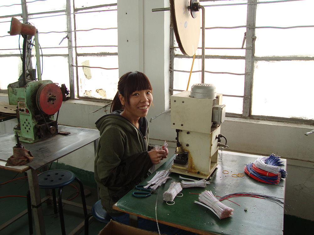 A 16-year-old migrant girl (name unknown) working in one of the manufacturing factories in Da Lang. Image: Maaike Zwart